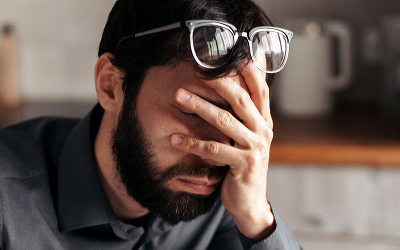 Man with his head in his hand