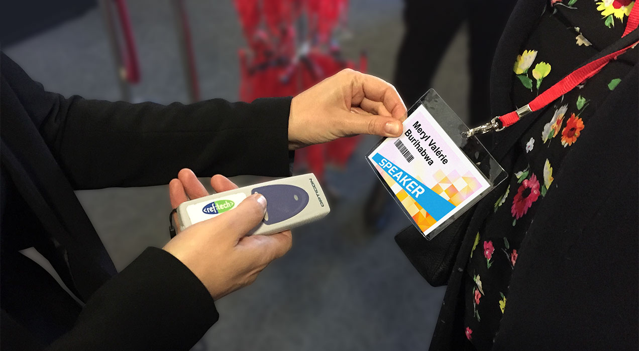 Badge being scanned with handheld scanner