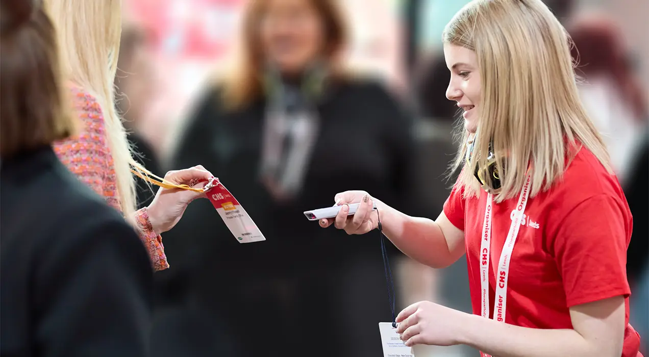 Badge being scanned with handheld scanner
