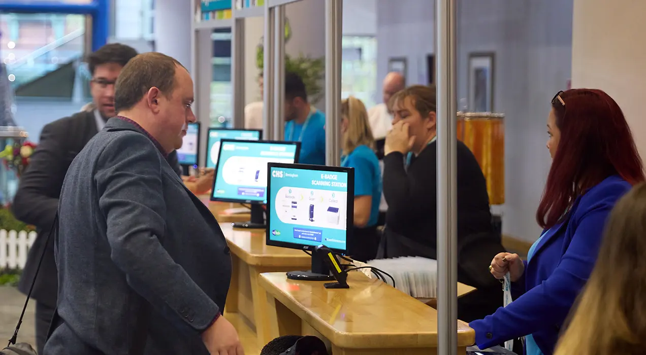 People at registration desks