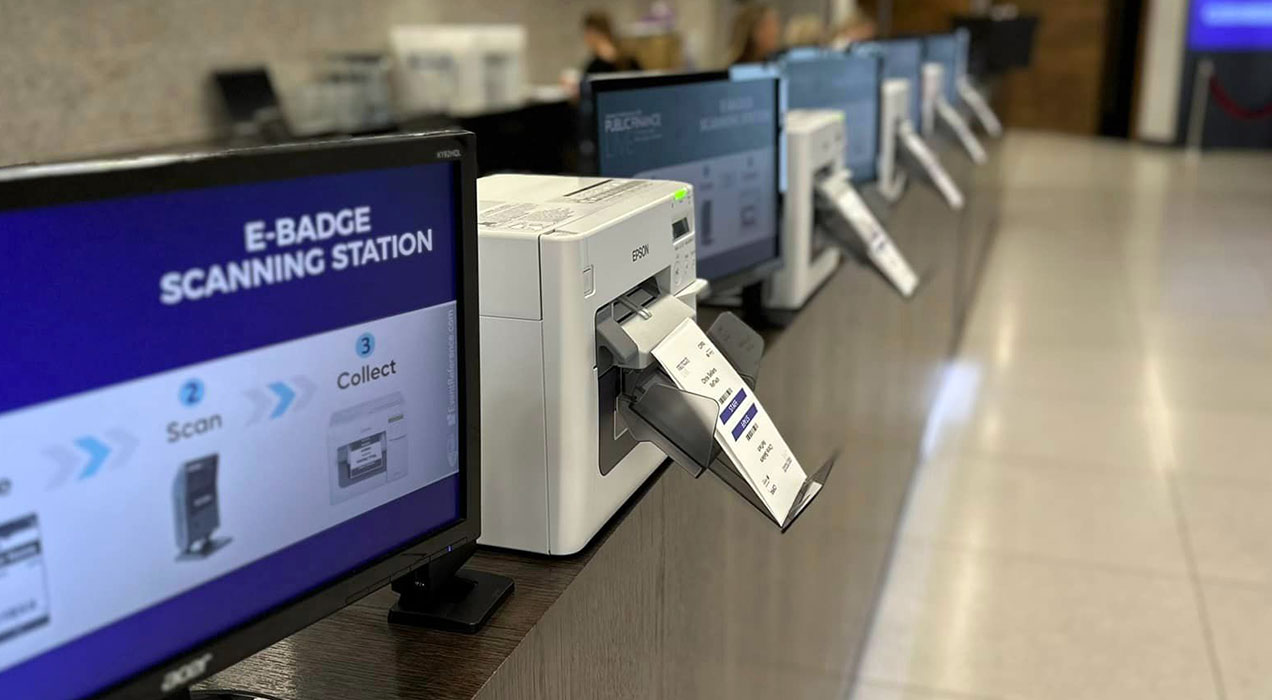 E-badge scanning and printing station