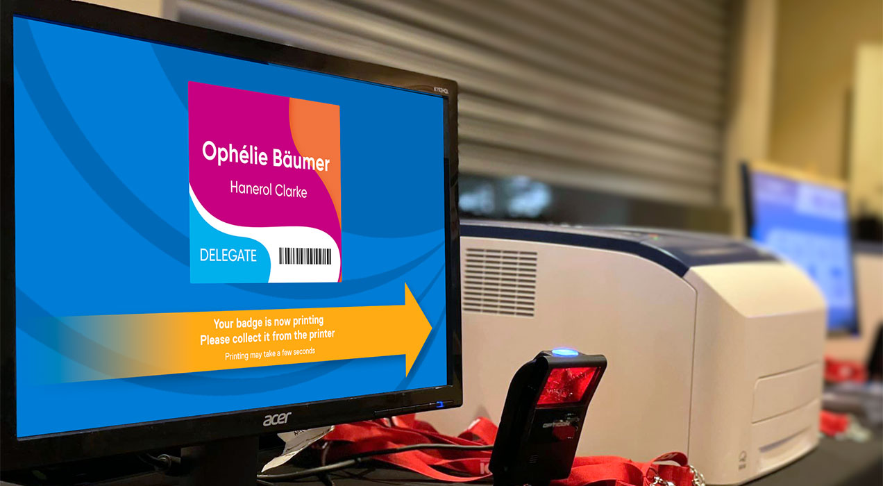 Badge preview screen with scanner and printer showing badges