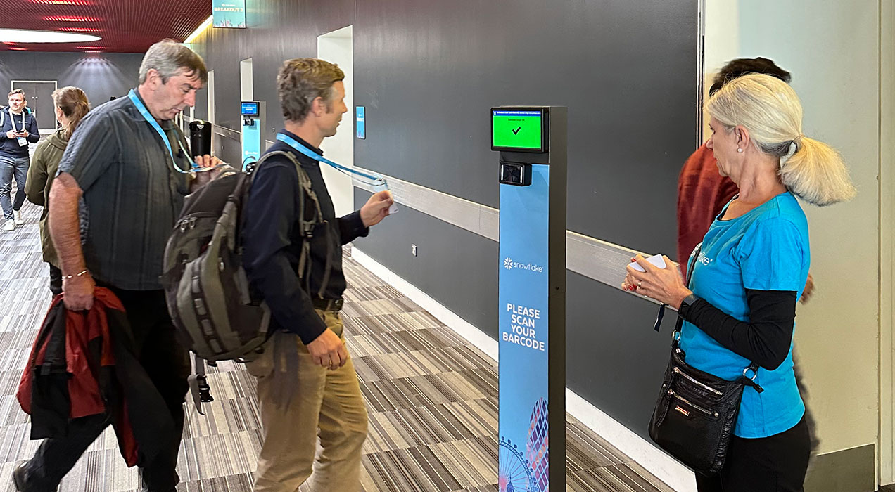 People scanning their badges at a ScanPod
